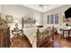 Elegant bedroom with hardwood floors, decorative iron bed frame, and neutral paint at 1080 Edmiston Pl, Longwood, FL 32779