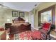 Bedroom featuring a hardwood floors, large mirror, and decorative accents at 1080 Edmiston Pl, Longwood, FL 32779