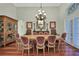 Formal dining room featuring hardwood floors, elegant furnishings, and ample natural light at 1080 Edmiston Pl, Longwood, FL 32779