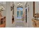 Grand foyer with high ceilings, elegant lighting, and open access to other rooms in the home at 1080 Edmiston Pl, Longwood, FL 32779