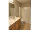 Standard bathroom showcasing a bathtub, toilet, and double sink vanity at 115 Royalty Cir, Sanford, FL 32771