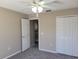 Bedroom with a ceiling fan, a closet and an open doorway at 115 Royalty Cir, Sanford, FL 32771