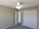 Comfortable bedroom with a ceiling fan and a large closet at 115 Royalty Cir, Sanford, FL 32771