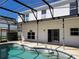 The house has a refreshing screened-in pool and patio, perfect for warm weather enjoyment at 115 Royalty Cir, Sanford, FL 32771