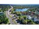 Aerial view showcases a home near a tranquil lake and a well-connected highway at 120 Lake Dr, Oviedo, FL 32765