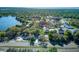 Aerial view of the property, showing its location near a lake and surrounded by trees at 120 Lake Dr, Oviedo, FL 32765