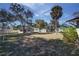 Expansive backyard with mature trees, a storage shed, and plenty of open space at 120 Lake Dr, Oviedo, FL 32765