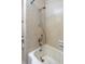 Close-up of a tiled bathtub and shower with silver fixtures in a clean bathroom at 120 Lake Dr, Oviedo, FL 32765