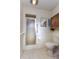 Classic bathroom with standing shower, toilet and wooden medicine cabinet at 120 Lake Dr, Oviedo, FL 32765