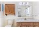 Traditional bathroom with vanity, mirror, and tiled backsplash at 120 Lake Dr, Oviedo, FL 32765