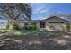 Charming single-story home featuring a stone facade and established landscaping at 120 Lake Dr, Oviedo, FL 32765