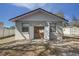 Outbuilding with an open screen door, revealing a glimpse of the interior and backyard at 120 Lake Dr, Oviedo, FL 32765