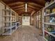 Inside the storage shed with shelving and a plywood floor at 120 Lake Dr, Oviedo, FL 32765