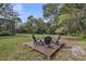 Backyard with wooden deck and patio furniture, surrounded by lush greenery, perfect for relaxation and gatherings at 137 Tangerine Ave, Oviedo, FL 32765