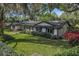 Well-maintained single-story home featuring manicured front yard and brick accents, offering classic curb appeal at 137 Tangerine Ave, Oviedo, FL 32765