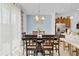 Cozy dining area with a large table, a light blue accent wall, and natural light at 1371 Captiva Cv, Sanford, FL 32771