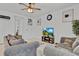 Comfortable living room with neutral walls, ceiling fan, and media center, creating an inviting space at 1371 Captiva Cv, Sanford, FL 32771