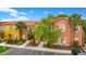 Charming townhome exterior showcasing colorful facades and well-maintained landscaping at 141 Pompano Beach Dr, Kissimmee, FL 34746