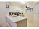 Well-lit kitchen with quartz countertop, stainless sink and faucet, and modern cabinets at 141 Pompano Beach Dr, Kissimmee, FL 34746