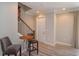 Inviting entryway with staircase and a cozy seating area perfect for a casual conversation or quick snack at 1447 Lake George Dr, Lake Mary, FL 32746