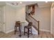 Inviting entryway with staircase and a cozy seating area perfect for a casual conversation or quick snack at 1447 Lake George Dr, Lake Mary, FL 32746