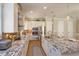 Modern kitchen with stainless steel appliances, white cabinetry, a large center island, and pendant lighting at 1447 Lake George Dr, Lake Mary, FL 32746