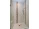 Modern walk-in shower with stylish tiling, glass doors, and dual shower heads at 1447 Lake George Dr, Lake Mary, FL 32746