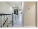 Hallway with white wood floors and white wood railings leading to bedrooms and other living spaces at 15221 Sunrise Grove Ct, Winter Garden, FL 34787