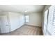 Bedroom featuring neutral carpet with closet and a window at 16248 Saint Kitts Cir, Clermont, FL 34714