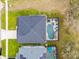 Aerial view of home showing the backyard pool and enclosed lanai at 16805 Sunrise Vista Dr, Clermont, FL 34714