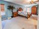 Bright, spacious bedroom features elegant furniture and a ceiling fan at 16805 Sunrise Vista Dr, Clermont, FL 34714