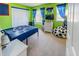 Sports themed bedroom with bright colors and playful decor at 16805 Sunrise Vista Dr, Clermont, FL 34714