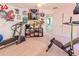 Finished home gym featuring workout equipment and TV at 16805 Sunrise Vista Dr, Clermont, FL 34714