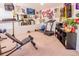 Finished home gym featuring workout equipment and wall decor at 16805 Sunrise Vista Dr, Clermont, FL 34714