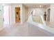 Bright hallway with neutral carpet leading to bedrooms and bathroom at 16805 Sunrise Vista Dr, Clermont, FL 34714