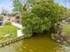 Aerial view of home on canal with fenced yard and boat dock at 217 Oak Park Pl, Casselberry, FL 32707