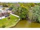 Aerial view of a two-story home with private backyard, fenced yard, and dock at 217 Oak Park Pl, Casselberry, FL 32707