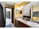 Bright bathroom with double sinks, wood cabinets, and neutral walls at 217 Oak Park Pl, Casselberry, FL 32707