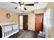 Cozy bedroom featuring a ceiling fan and ample natural light at 217 Oak Park Pl, Casselberry, FL 32707