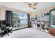 Bright bedroom featuring a black office chair, lots of storage, and a water view at 217 Oak Park Pl, Casselberry, FL 32707