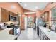 Bright kitchen featuring stainless steel appliances, wood cabinets, and ample counter space at 217 Oak Park Pl, Casselberry, FL 32707