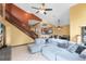 Inviting living room featuring a staircase, large windows, and an open layout design at 217 Oak Park Pl, Casselberry, FL 32707