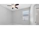 Bright bedroom features a ceiling fan and a sunny window at 2224 Romanum Dr, Winter Garden, FL 34787