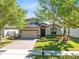 Charming two-story home with a brick driveway, well-manicured lawn, mature trees, and a two-car garage at 2224 Romanum Dr, Winter Garden, FL 34787