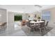 Bright living room featuring marble floors, modern furniture, and a sliding glass door to the backyard at 2224 Romanum Dr, Winter Garden, FL 34787