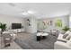 Bright living room with neutral colors, modern furniture, and plenty of natural light at 2224 Romanum Dr, Winter Garden, FL 34787