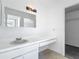 This bathroom features a vanity area with mirror, sink, storage, and counter space at 2253 Atrium Cir, Orlando, FL 32808