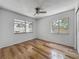 Bedroom with two large windows, ceiling fan and wood-look flooring at 2253 Atrium Cir, Orlando, FL 32808