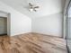 Bright bedroom with high ceiling, wood-look floors, and access to outdoor area at 2253 Atrium Cir, Orlando, FL 32808