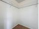 Walk-in closet has built-in shelving and carpeted floors for storage and organization at 2253 Atrium Cir, Orlando, FL 32808